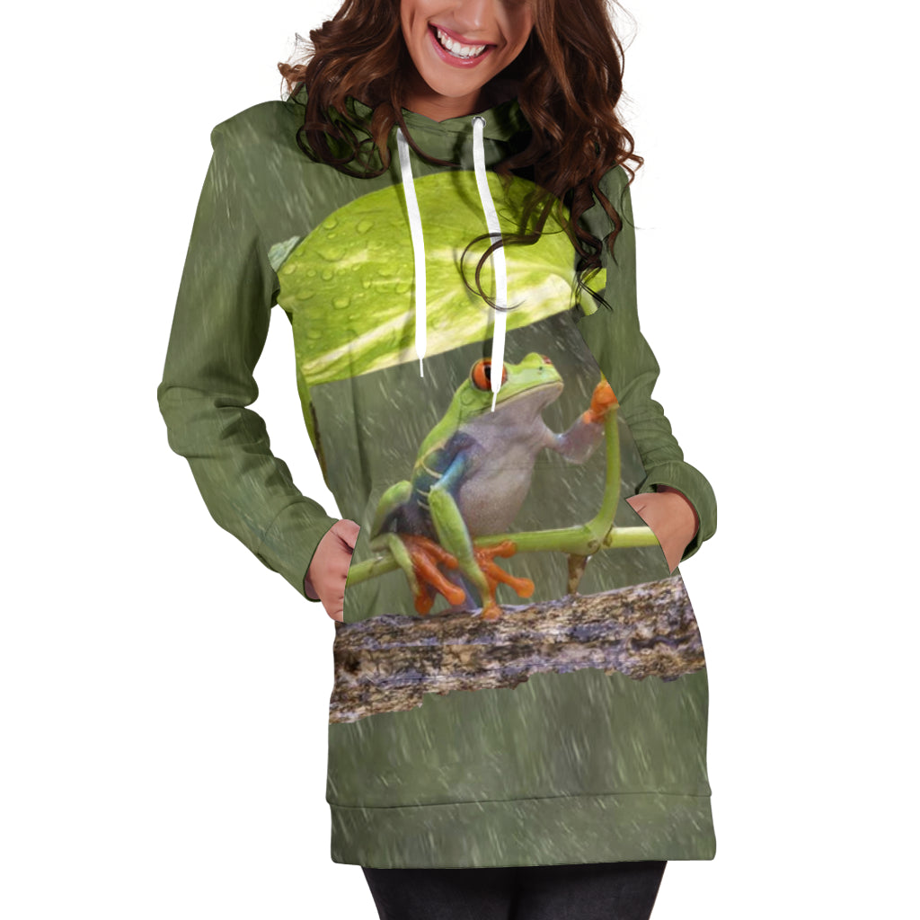 Front view of Frog in The Rain Luxury Woman Dress worn by female model with both hands in dress pockets – Black Owned fashion, custom-made premium polyester hoodie dress with elegant streetwear style.