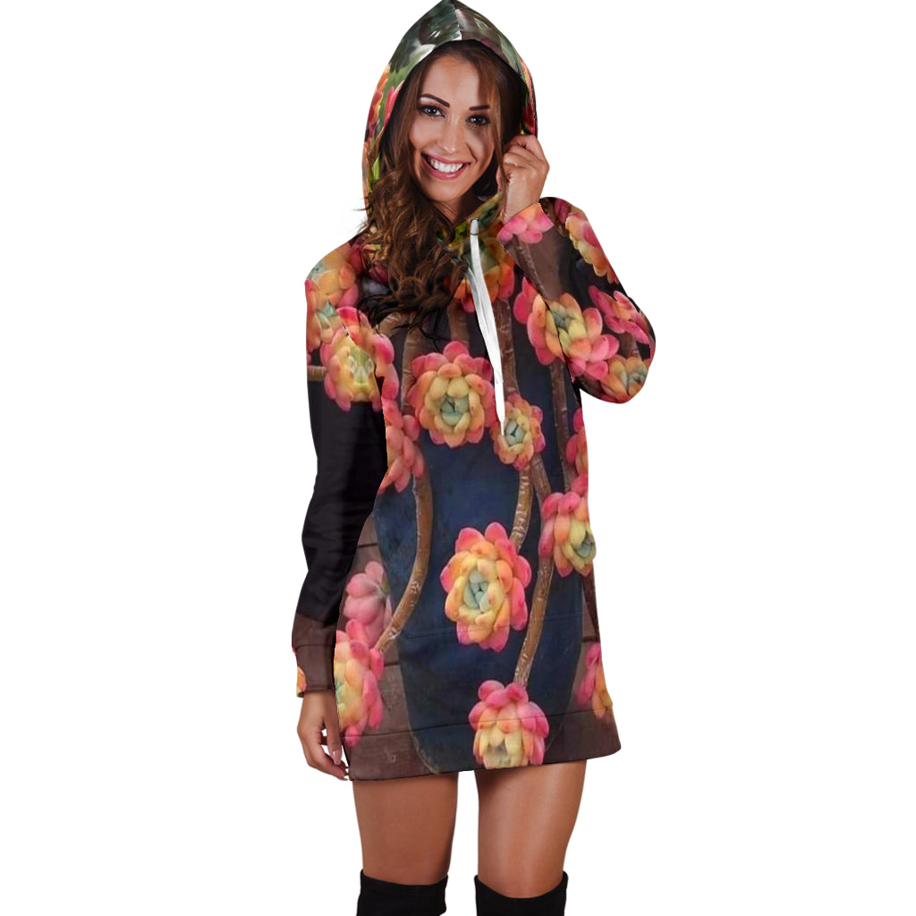 Front view of Succulent Flower Women's Hoodie Dress with model posing hands near ears – Black Owned fashion hoodie dress blending bold floral print with everyday comfort.