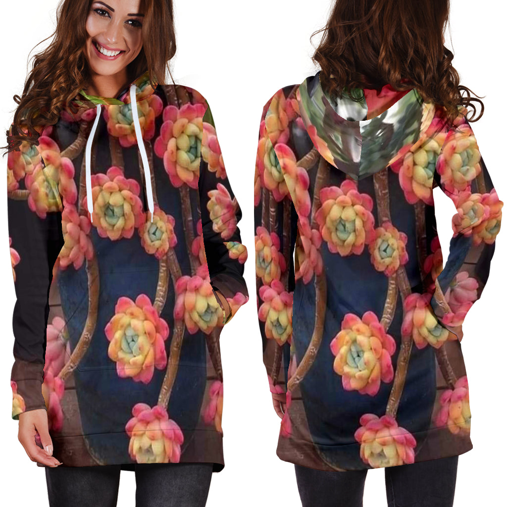 Model wearing Succulent Flower Women's Hoodie Dress with one hand in pocket – Black Owned handcrafted hoodie dress offering modern floral fashion and cultural elegance.