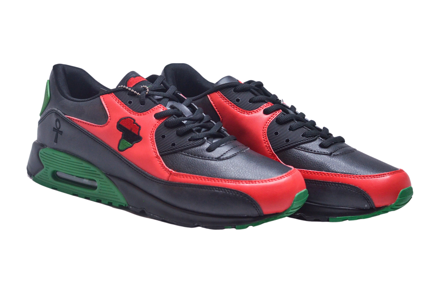 A pair of African-inspired running sneakers with red, black, and green colors, featuring a graphic of a black power fist on the side.