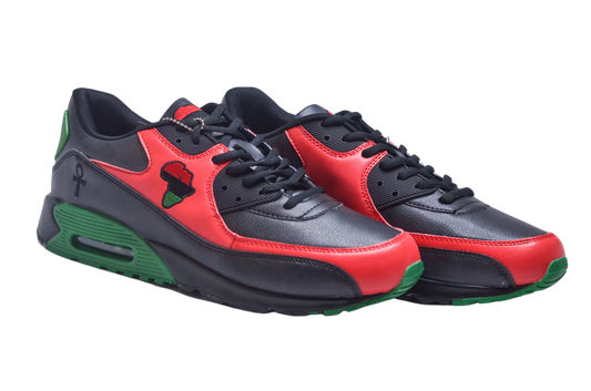 A pair of African-inspired running sneakers with red, black, and green colors, featuring a graphic of a black power fist on the side.