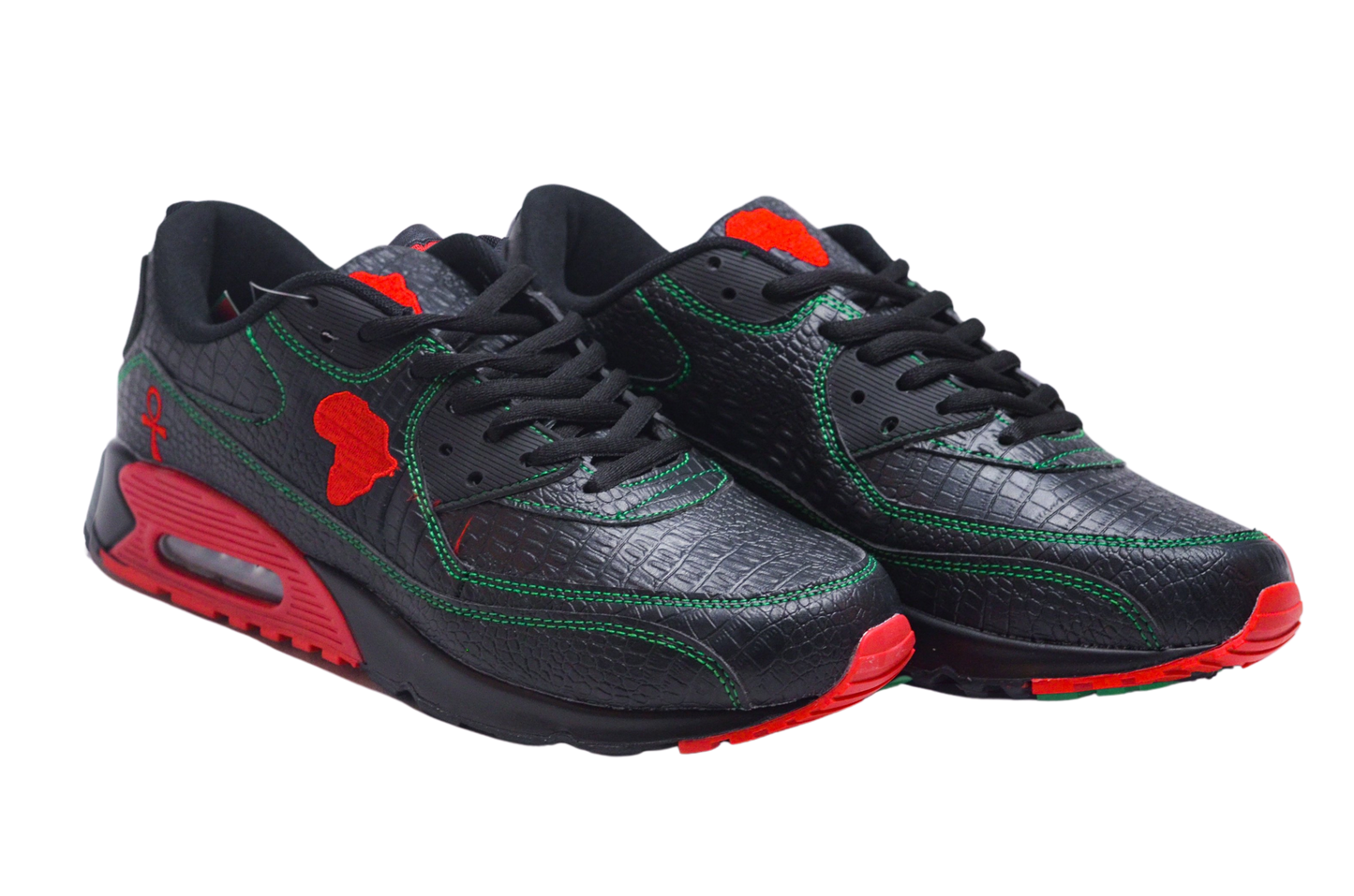 MLK-sneakers Black-Owned main pair of MLK sneakers with a red, black, and green color scheme, featuring a snakeskin print and green stitching.
