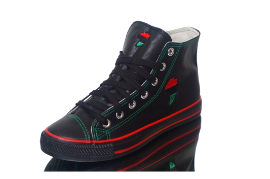 A pair of RBG Hi-Top leather sneakers with a black base color, featuring red and green accents and laces.
