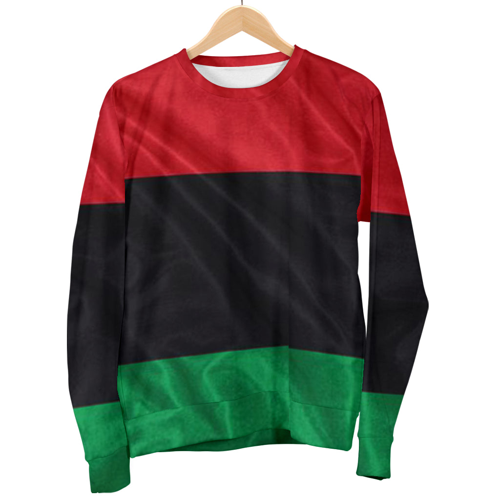A sweater with a red, black, and green color scheme, designed in a pullover style with elasticated cuffs.
