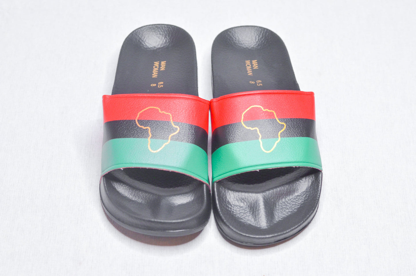 Top-down view of RBG Slippers – Cultural footwear honoring African pride by Nagast Footwear