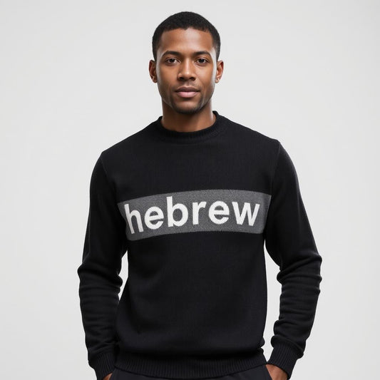 A man wearing a black Hebrew wool knitting fashion hoodie with the text 'HEBREW' displayed on the front.