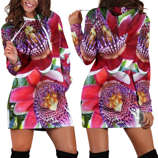 A woman wearing a multicolored floral hoodie dress with a high hood, posing from the front and back.