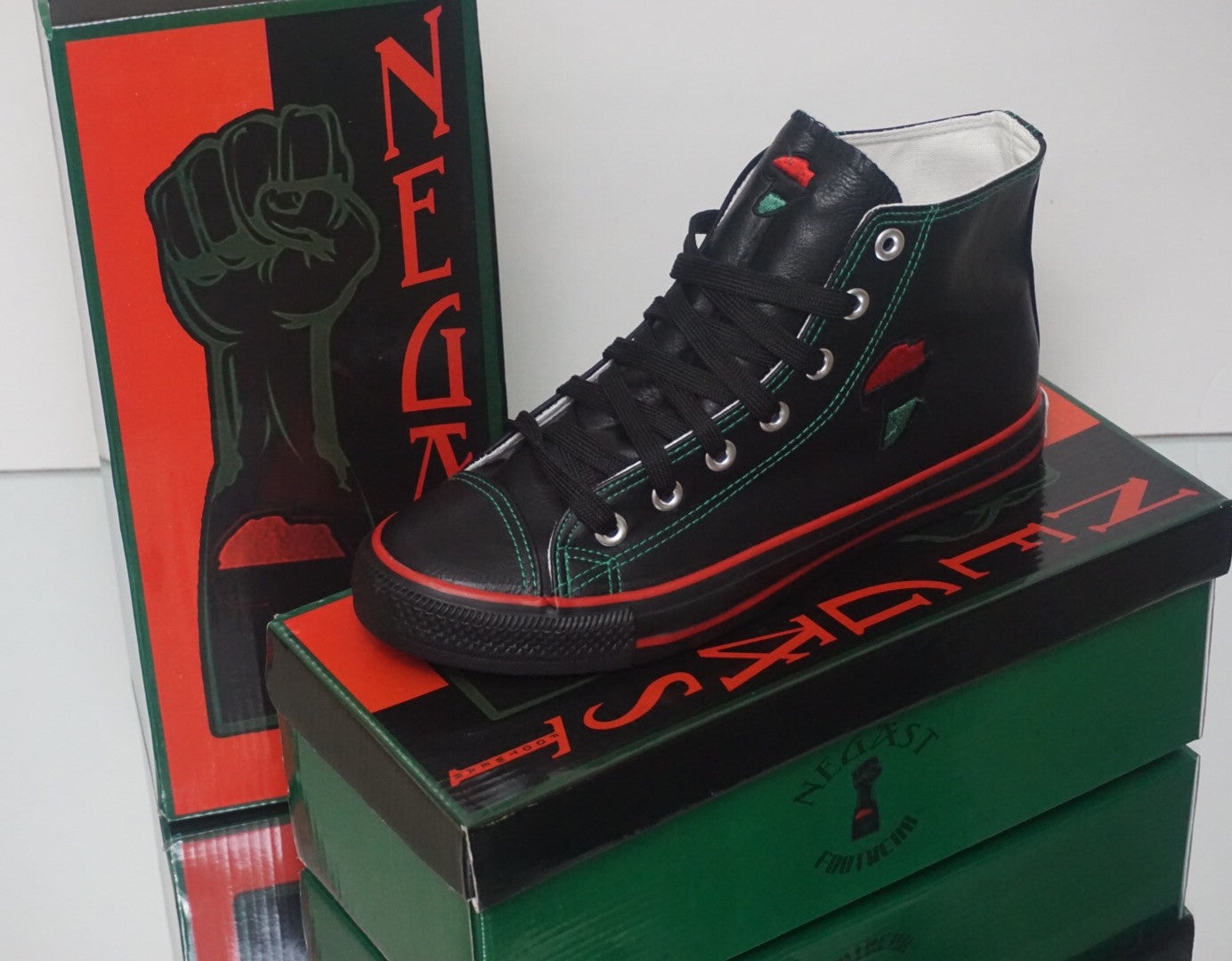 RBG Hi Top Leather Sneakers displayed on RBG-themed shoebox, premium Black-owned collectible footwear.
